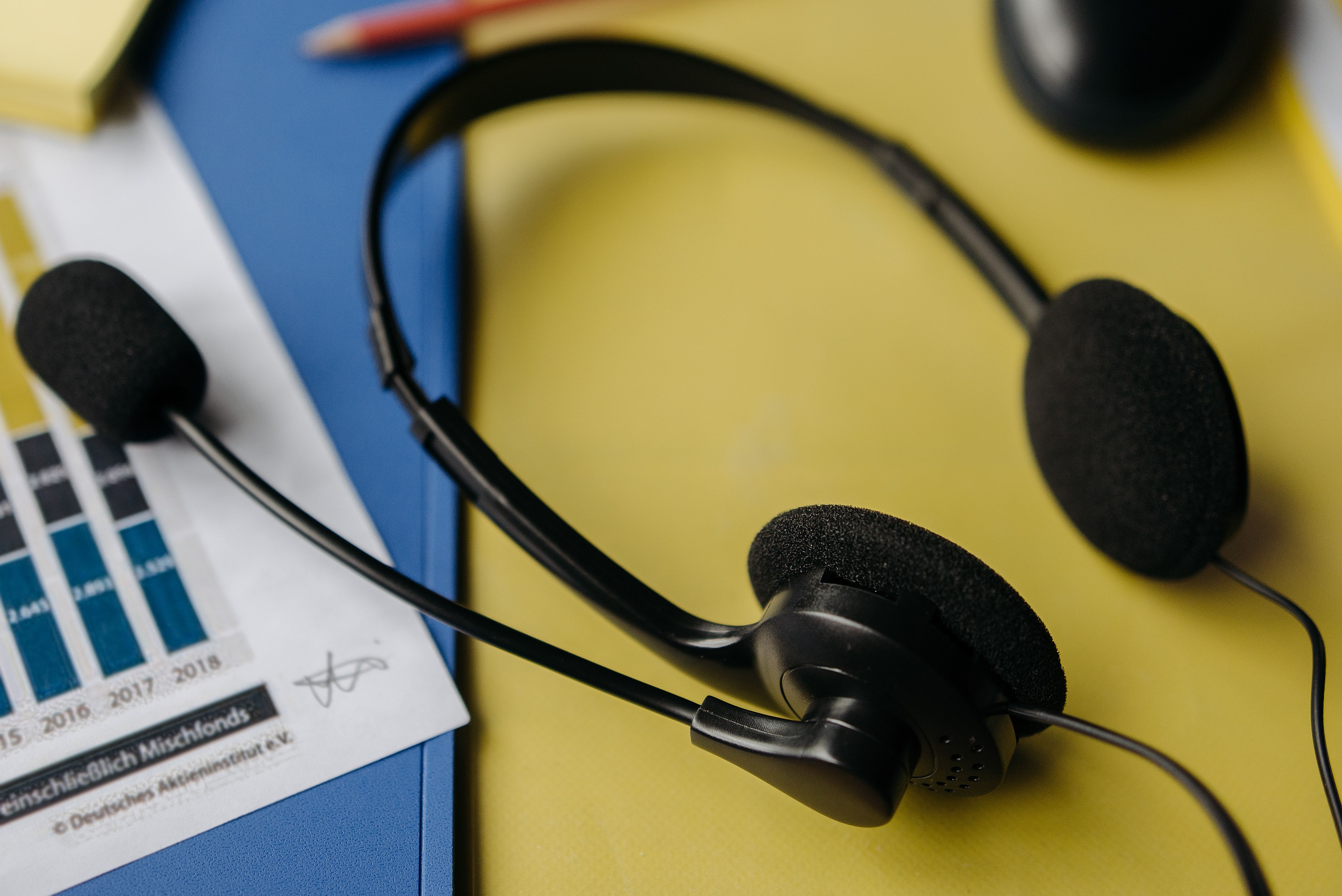 Call headset beside performance charts